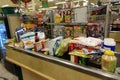 A typical grocery checkout counter filled with food and disinfectant cleaning supplies at a Publix grocery store