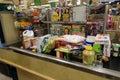 A typical grocery checkout counter filled with food and disinfectant cleaning supplies at a Publix grocery store