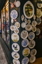 Typical handicraft product, hand painted plates hanging on the wall of a souvenir shop in Venice, Italy