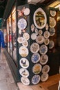 Typical handicraft product, hand painted plates hanging on the wall of a souvenir shop in Venice, Italy