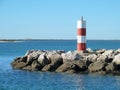 Lighttower and harbor entrance in Fuseta, Algarve - Portugal