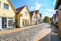 Typical historic picturesque street of shops and homes in the historic fishing village of Warnemunde Rostock Germany