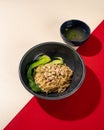 Typical Hong Kong yamin noodles topped with chicken and served with vegetables