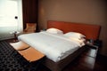 Moscow, Russia - February 13, 2021: Typical hotel room. Bed is covered with snow-white linens, pillows, window