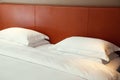 Typical hotel room. Double bed with white linen, two pillows Royalty Free Stock Photo