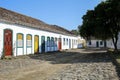 Typical house facades with colorful doors and windows on sunny day in historic town Paraty, Brazil, Unesco World Heritage Royalty Free Stock Photo