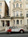 Typical house in Notting Hill district with vintage car