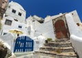A typical house in the town of Oia in Santorini, Greece with stucco and stone walls Royalty Free Stock Photo