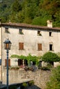 Typical house with wall and flowers in Cison di Valmarino in the province of Treviso (Italy)