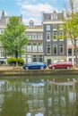 Typical Houses on the Amsterdam Canal and Cars Royalty Free Stock Photo