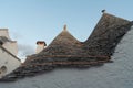 Typical houses built with dry stone walls and conical roofs of the Trulli, in the evening day, Apulia, Italy Royalty Free Stock Photo