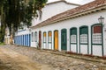 Typical houses with colorful doors and windows in a cobblestone street in historic town Paraty, Brazil, Unesco World Heritage Royalty Free Stock Photo