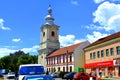 Typical houses. Medieval saxon church. Urban landscape in the city Rupea-Reps, Transylvania. Royalty Free Stock Photo