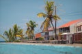 Typical houses in puerto limon, a coastal city in costa rica on a sunny day. Close to beach, palms are seen Royalty Free Stock Photo