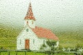 Typical Icelandic church photographed through rainy window Royalty Free Stock Photo