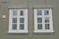 Typical Icelandic house facade in gray color made of corrugated iron and with white wooden windows in Reykjavik Royalty Free Stock Photo