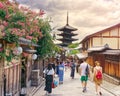 Tourist walking in higashiyama, Gion district, the old streets of Kyoto, with Yasaka pagoda in the background scene Royalty Free Stock Photo