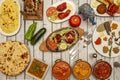 Typical Indian food dishes with many curries, mild and strong, naan