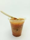 a typical Indonesian food called meatballs, served in a plastic cup with additional noodle filling and celery leaf topping topped Royalty Free Stock Photo