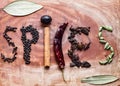 Typical ingredients for a garam masala black peppercorns, mace, cinnamon, cloves, dried red chilli and green cardamom in a wooden Royalty Free Stock Photo