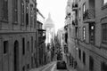 Valletta, Malta, August 2019. Black and white view of Maltese street and the far silhouette of the cathedral.