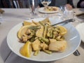 A typical Italian dish fried seafood: shrimp, squid, octopus and a slice of lemon. Italian fast food. Fish and chips Royalty Free Stock Photo