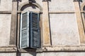 Typical italian window with grey wall close up. Free space for your text Royalty Free Stock Photo