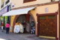 A typical ladies fashion shop with street displays and inviting archway entrance in the Spanish island of Teneriffe in the Canarys