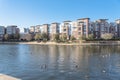 Lakeside apartment building complex with blue sky in America