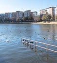 Lakeside apartment building complex with blue sky in America