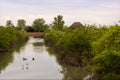 Typical landscape of the Marano lagoon, a town on the Adriatic sea, in spring. Visible the casoni and wild animals. Royalty Free Stock Photo