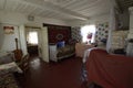 Typical living room in the Ukrainian rural house clay stove beds carpets chairs table. 2021. Teterivske village, Kyiv