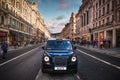 Typical London black cab at Regent Street, a famous landmark of London