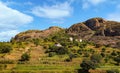 Typical Madagascar landscape - green and yellow rice terrace fields on small hills with clay houses in region near Royalty Free Stock Photo