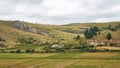 Typical Madagascar landscape - green and yellow rice terrace fields on small hills in region near Farariana Royalty Free Stock Photo