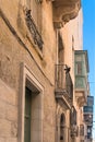 Malta, Marsaxlokk, August 2019. Pigeons on the facade of a Maltese house. Royalty Free Stock Photo