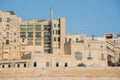 Typical Maltese buildings with yellow facade