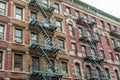 Typical Manhattan Apartments with Fire Escape Ladders in New York City. Low Angle View of an Apartment Block