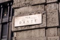 Typical marble streetn name plate in Milan, Italy. Via Dante