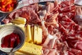 Sauris - Typical meat plate served in traditional mountain cottage in Carnic Alps, Friuli Venezia Giulia Royalty Free Stock Photo