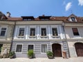 Typical Medieval Facade of an old appartment residential building in a street of old town, the historical center of Ljubljana Royalty Free Stock Photo