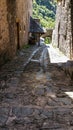 Arch and sunny paved street