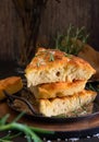 Mediterranean focaccia with olive oil and rosemary on a dark background Royalty Free Stock Photo