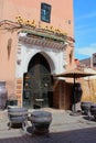 Moroccan city house in Marrrakesh with decorations and an umbrella in front of the entrance