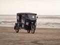 Typical mototaxi manipulated motorbike taxi trike tricycle passenger transport vehicle on Pimentel beach Chiclayo Peru