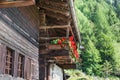 Typical mountain house with flowered balcony, European Alps