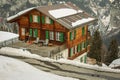 Typical mountain houses in the village of Murren in Swiss alps on a cold winter day Royalty Free Stock Photo