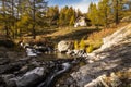 Typical mountain hut on the river in the Alps on the Simplonpass Royalty Free Stock Photo