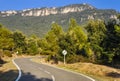 Typical mountain road in Spain with crossed 60 km/h speed limit. Royalty Free Stock Photo