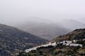 Typical mountain village in fog